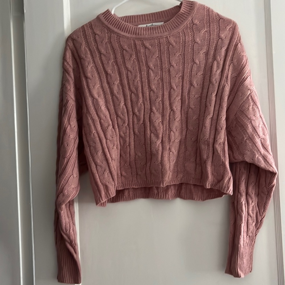 Pink cropped sweater.